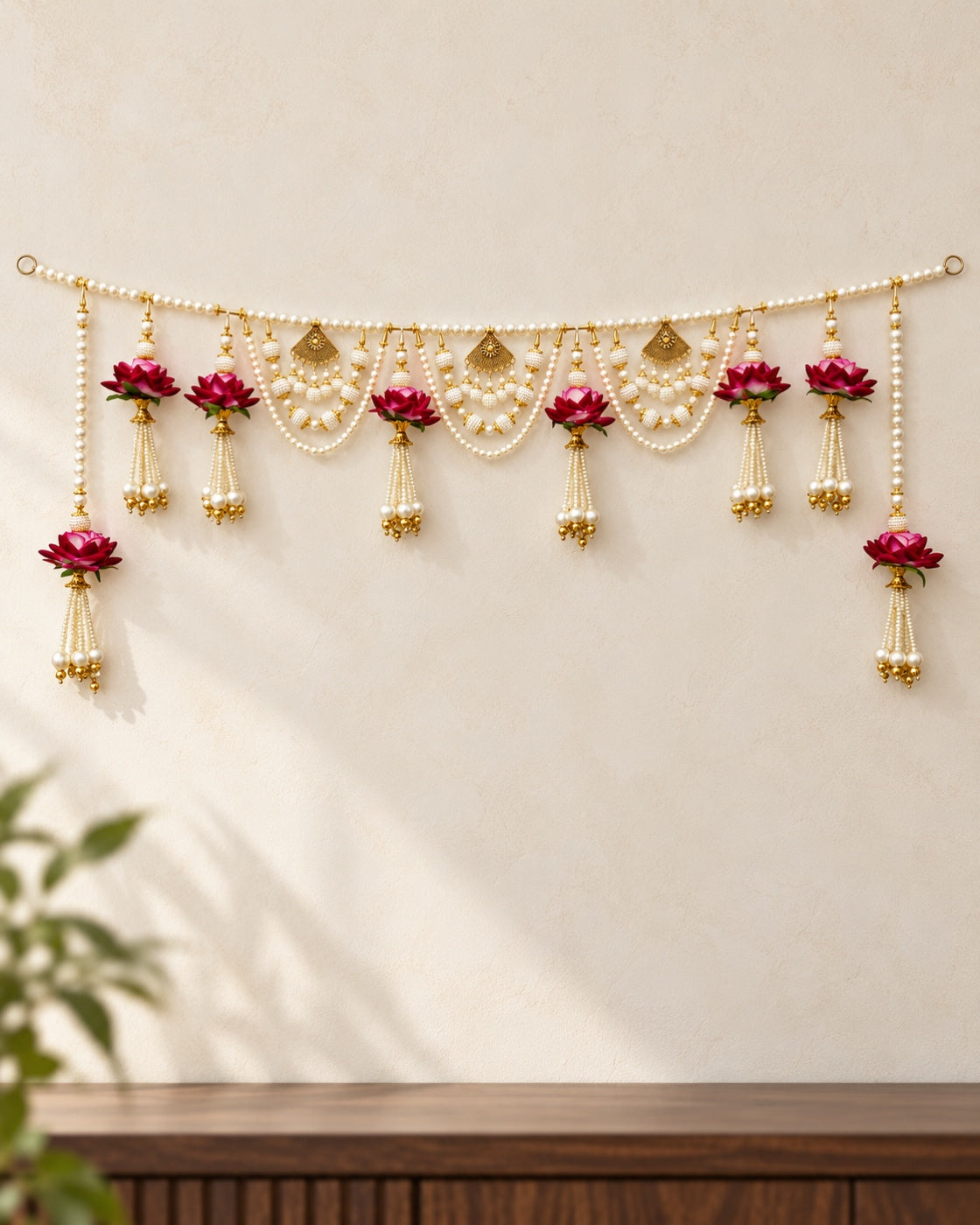 Gulabi Rose Pearl Swag Toran - full product on a cream wall