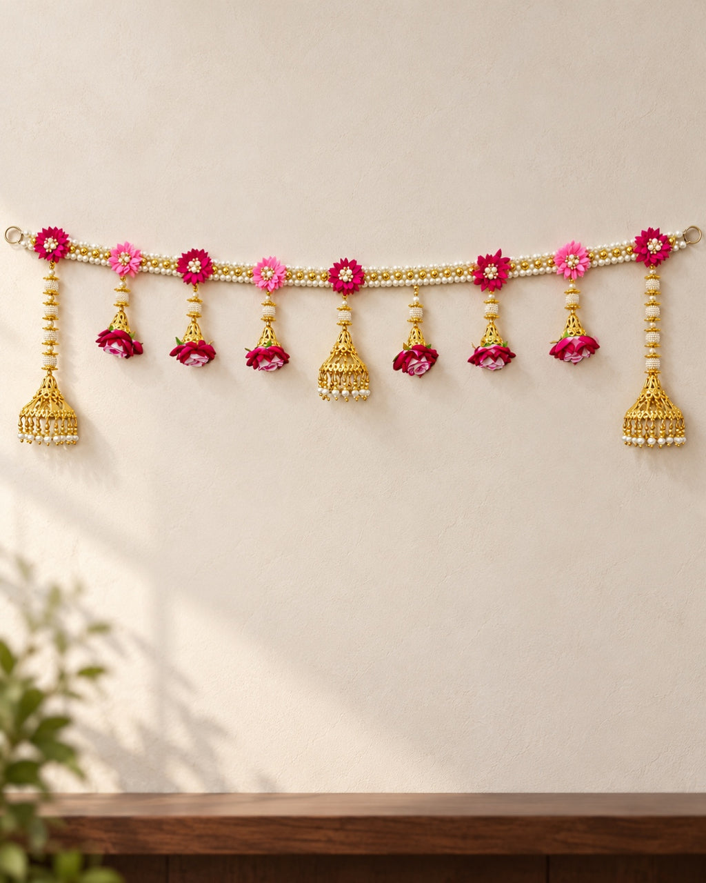 Gulabi Floral Jhumka Toran - full product on a cream wall