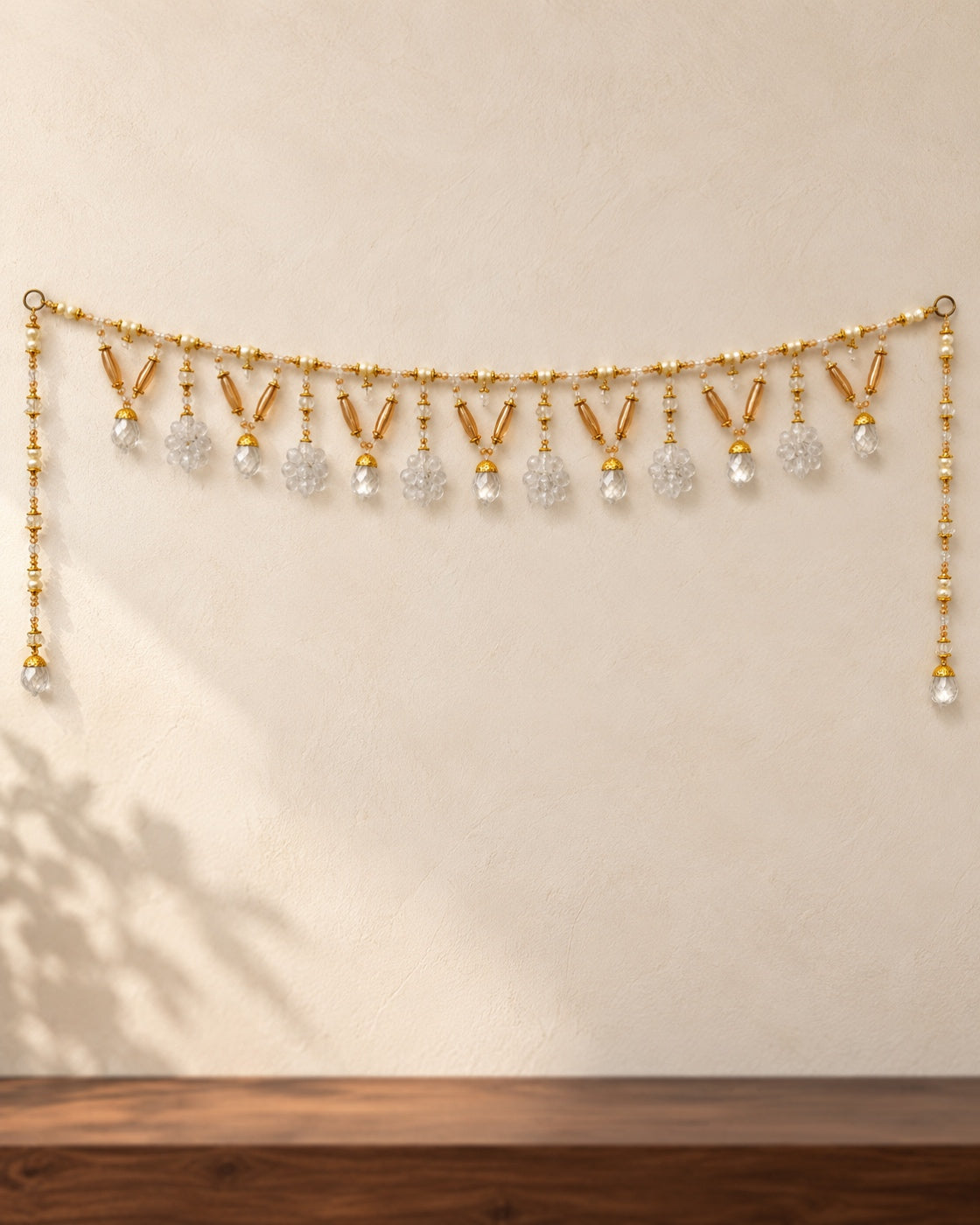 Amber Clear Drop Toran - full product on a cream wall
