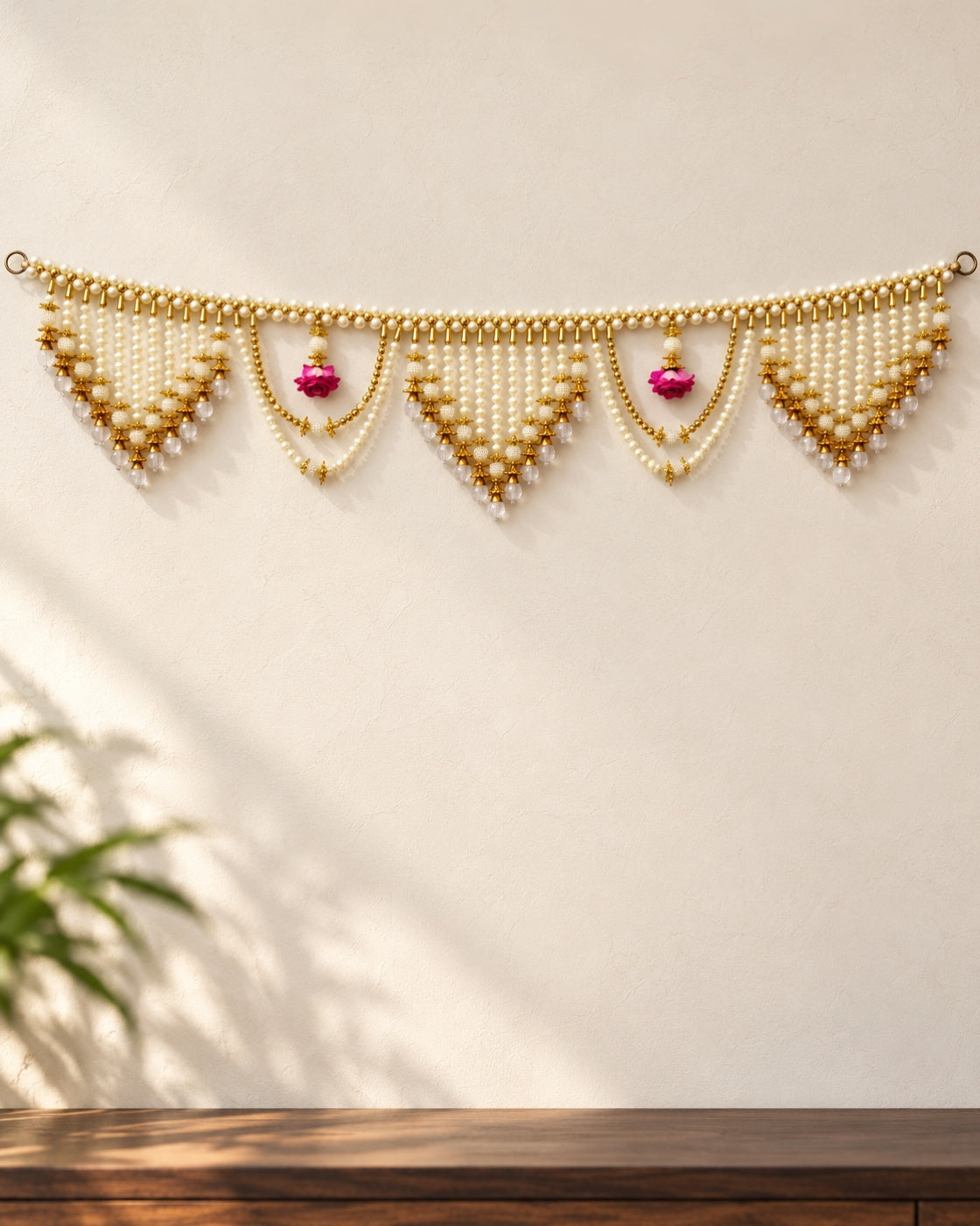 Moti Rose Cascade Toran - full product on a cream wall