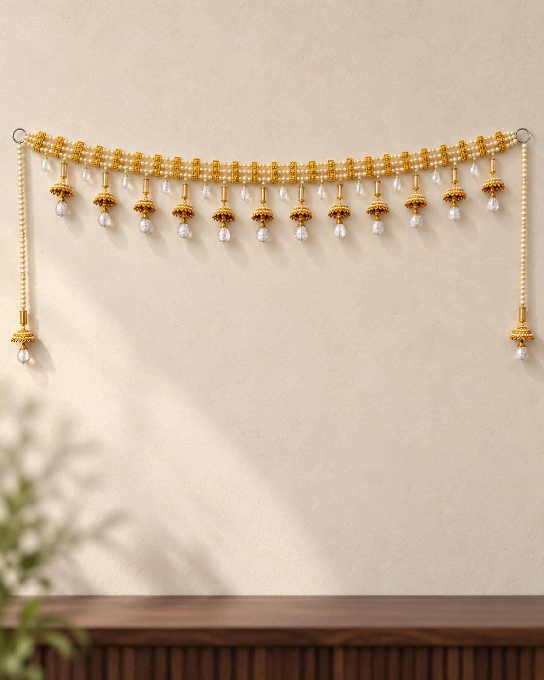Amber Jhumka Crystal Drop Toran - full product on a cream wall
