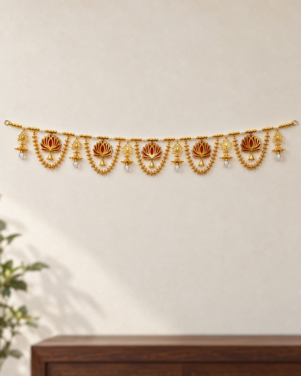 Kamal Gold Swag Toran - full product on a cream wall