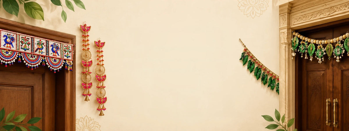 Torans and a leaf garland hanging on a cream wall